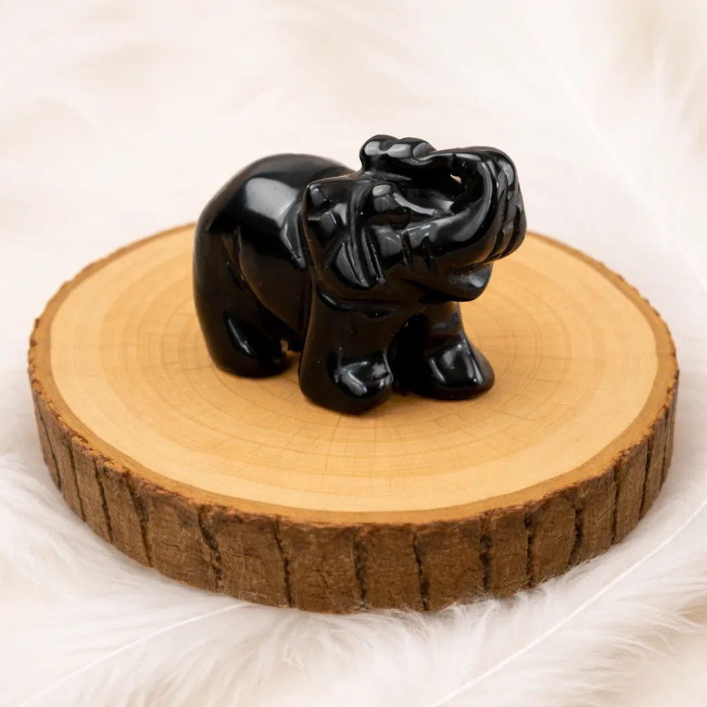 éléphant en obsidienne noire figurine pierre naturelle sur rondin bois